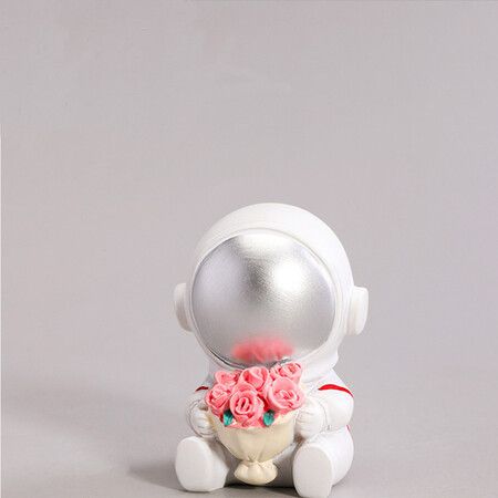 Mini space astronaut model ornaments sitting style embracing flower