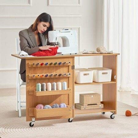 Folding Sewing Table with Lockable Wheels Shelves Trays Door Wood Color